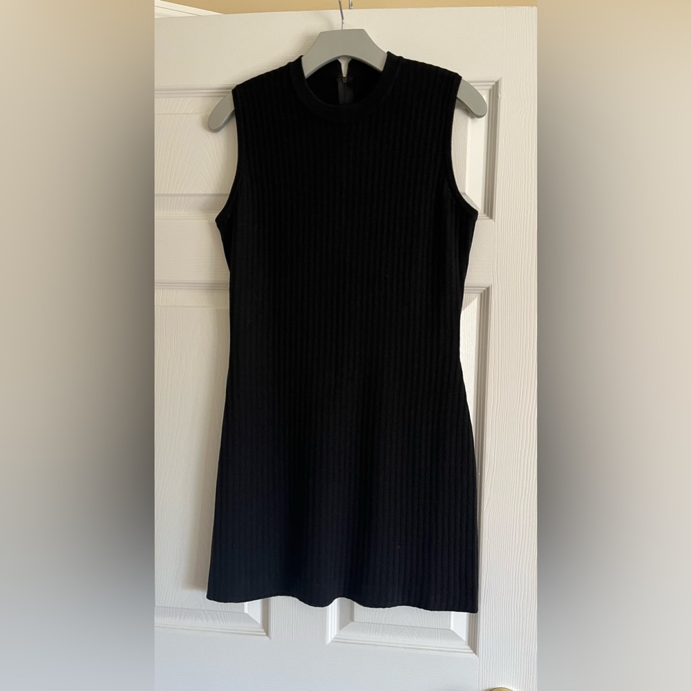 St John evening crew neck black knit dress with concealed back zipper. Size 6